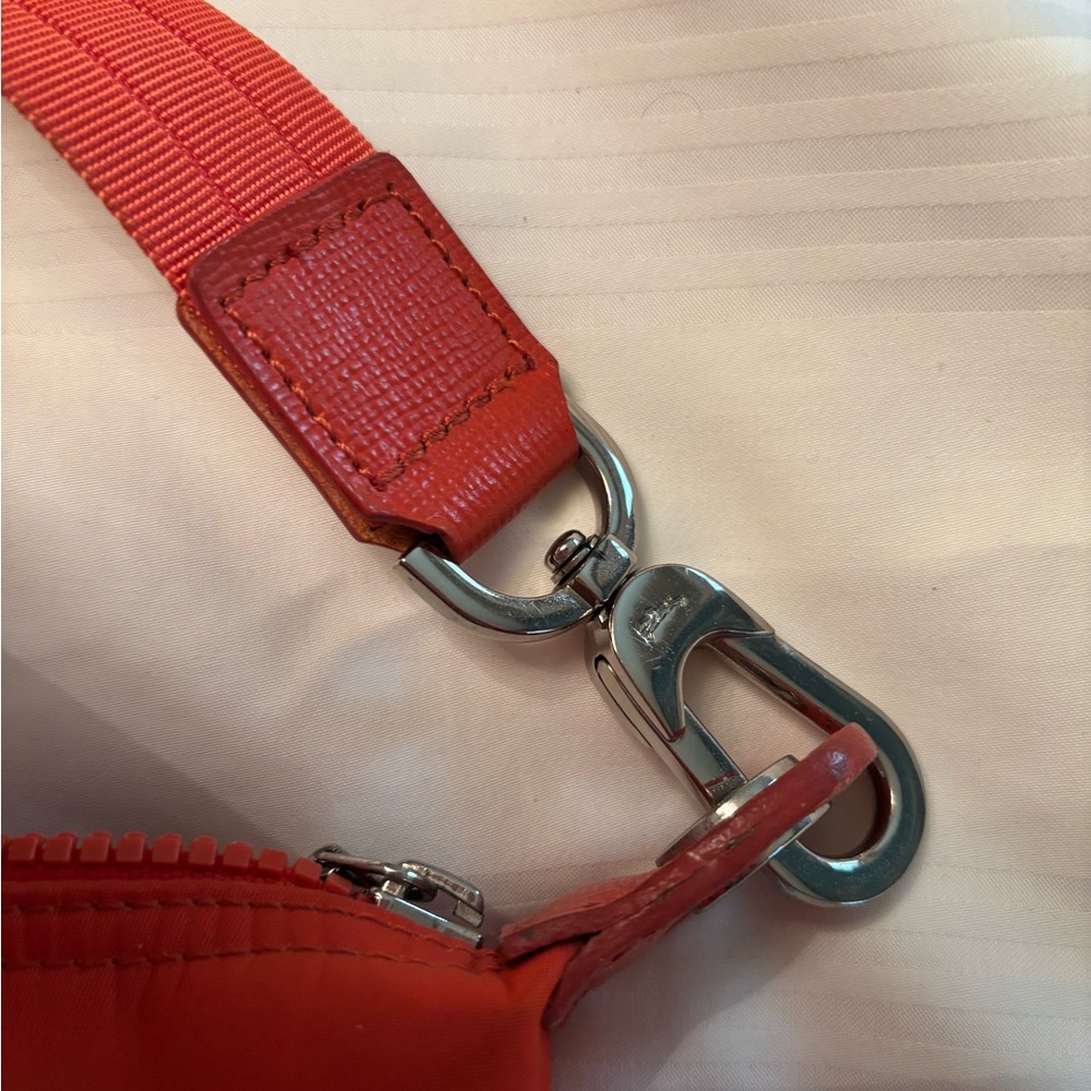 Coral/orange with detachable strap. VERY good condition. - Picture 5 of 5